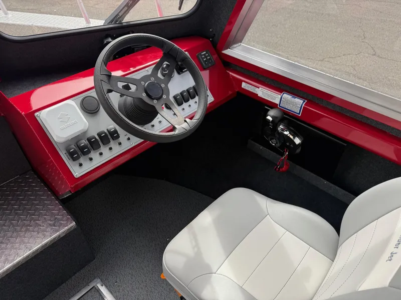 Slide: The Image of 2025 Thunder Jet 24 Alexis Pro boat interior with steering wheel and control panel. - 22