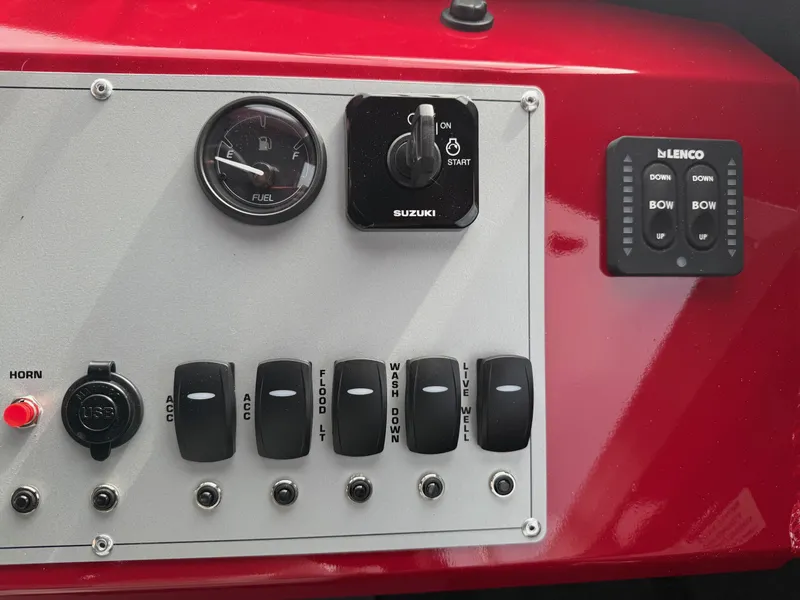 Slide: The Image of Control panel of 2025 Thunder Jet 24 Alexis Pro boat with switches and gauges. - 25