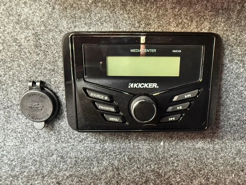 Slide: The Image of Kicker media center in 2025 Thunder Jet 24 Alexis Pro boat interior. - 27