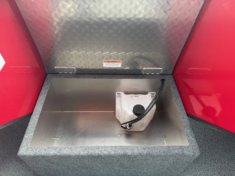 Slide: The Image of Storage compartment of 2025 Thunder Jet 24 Alexis Pro boat, featuring a secure latch. - 30