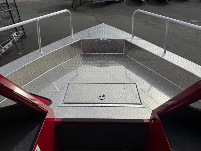 Slide: The Image of 2025 Thunder Jet 24 Alexis Pro boat deck with diamond plate flooring and storage hatch. - 31
