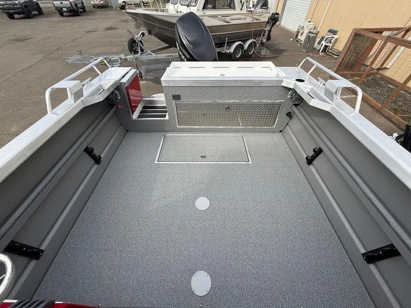 Slide: The Image of 2025 Thunder Jet 24 Alexis Pro boat interior with spacious deck and storage compartments. - 6