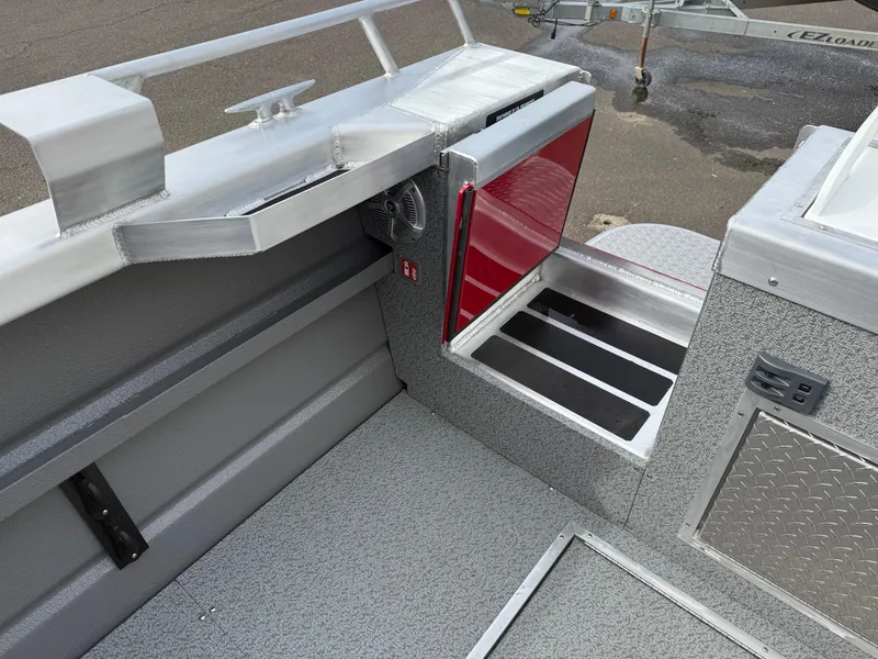 Slide: The Image of 2025 Thunder Jet 24 Alexis Pro boat interior with storage compartments and sleek design. - 7