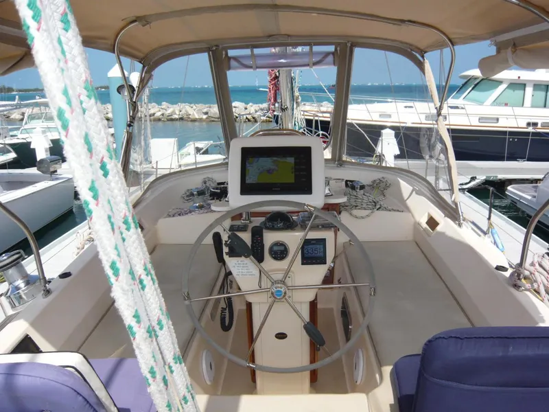 Slide: The Image of Cockpit of 2008 Island Packet 465 sailboat with navigation equipment and steering wheel. - 14