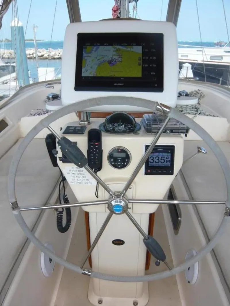 Slide: The Image of 2008 Island Packet 465 yacht helm with navigation equipment and steering wheel. - 15