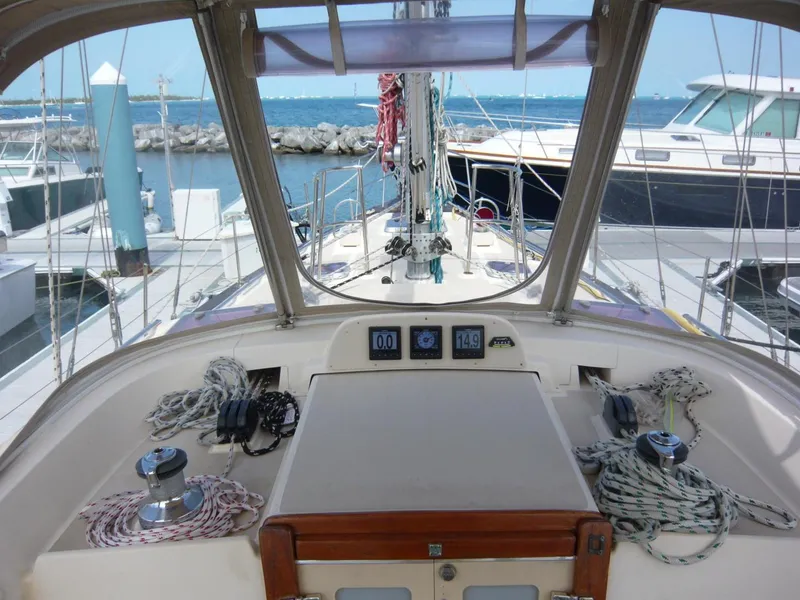 Slide: The Image of Cockpit view of 2008 Island Packet 465 sailboat docked at marina. - 16