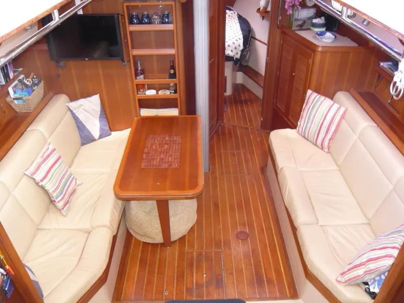 Slide: The Image of Interior of 2008 Island Packet 465 yacht with cozy seating and wooden finishes. - 20