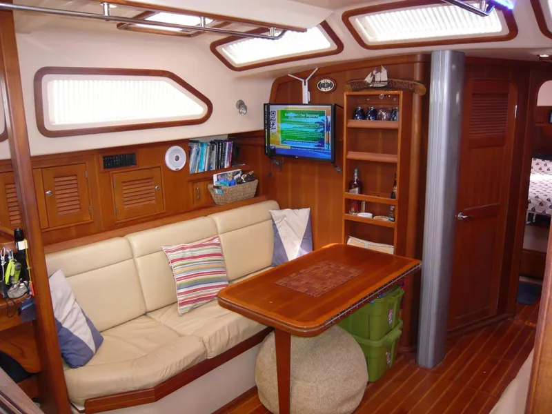 Slide: The Image of Interior of 2008 Island Packet 465 yacht with cozy seating and wooden furnishings. - 21