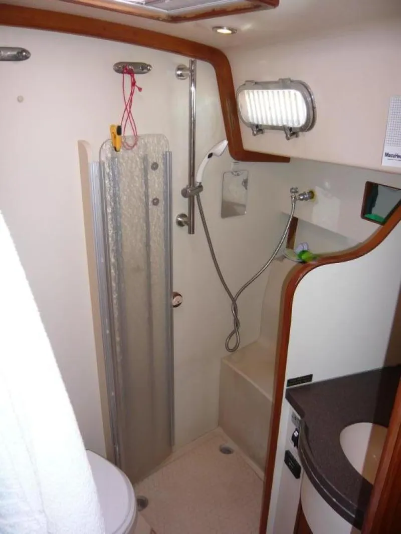 Slide: The Image of 2008 Island Packet 465 yacht bathroom with shower, sink, and modern fixtures. - 30