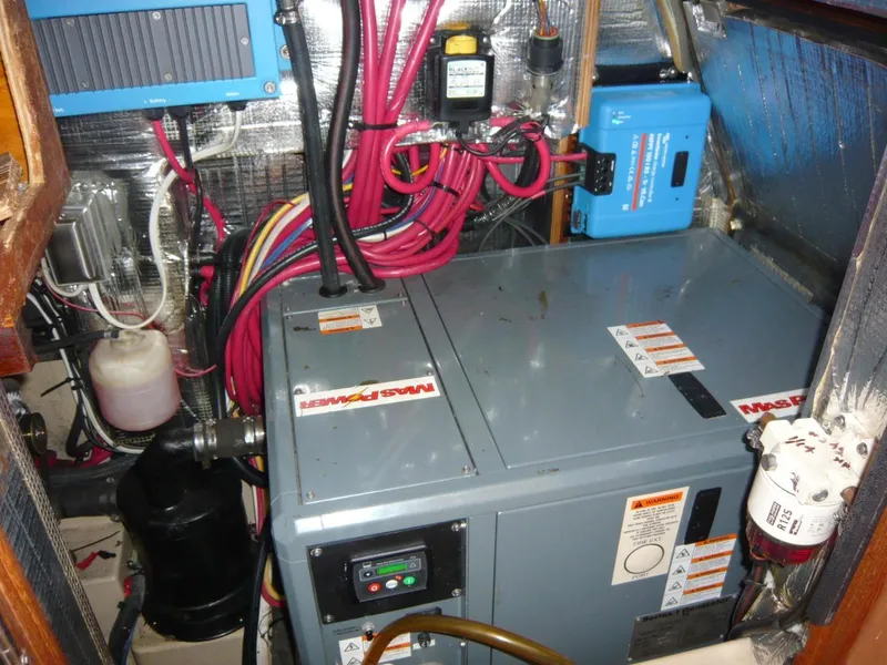 Slide: The Image of Engine room of a 2008 Island Packet 465 yacht with electrical components and wiring. - 34