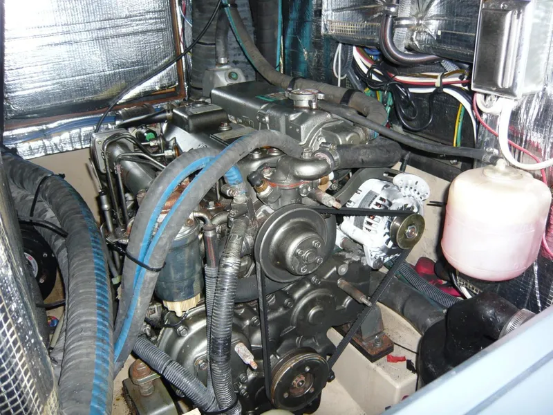 Slide: The Image of Engine compartment of a 2008 Island Packet 465 sailboat, showcasing mechanical components. - 35