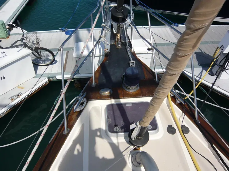 Slide: The Image of Bow view of 2008 Island Packet 465 sailboat docked at marina. - 9