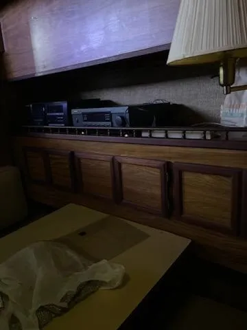 Slide: The Image of Interior of 1980 Viking 43 Double Cabin with wooden cabinetry and vintage electronics. - 11