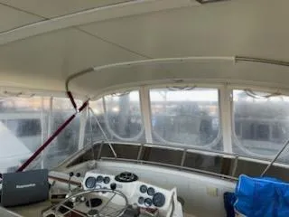 Slide: The Image of 1980 Viking 43 Double Cabin interior with helm, steering wheel, and navigation equipment. - 2