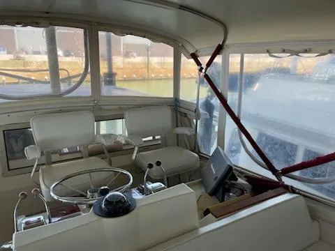 Slide: The Image of Interior of 1980 Viking 43 Double Cabin yacht with steering wheel and seating. - 3