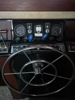 Slide: The Image of 1980 Viking 43 Double Cabin helm with gauges and steering wheel. - 7