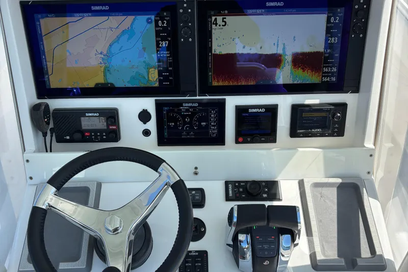 Slide: The Image of Control panel of 2018 Invincible 33 Open Fisherman with Simrad navigation displays. - 4