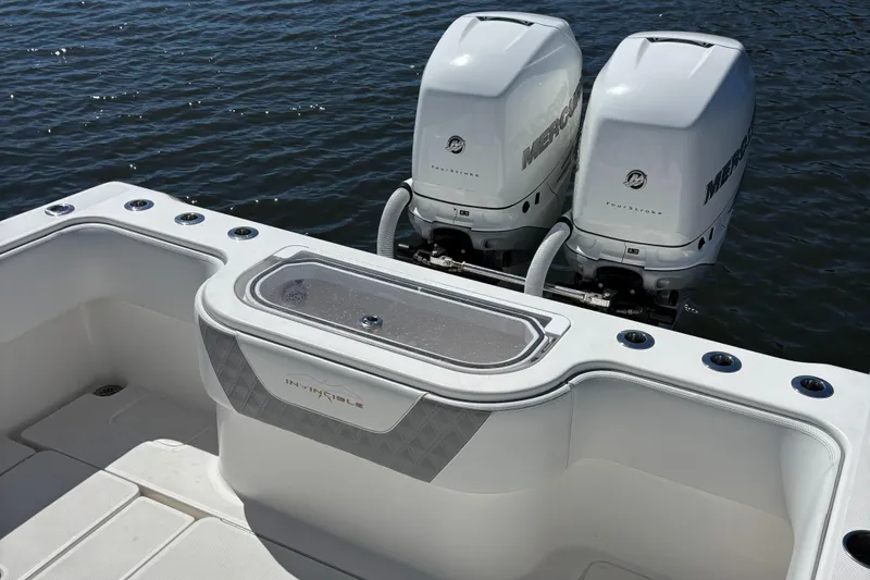 Slide: The Image of 2018 Invincible 33 Open Fisherman boat with twin outboard engines on water. - 6
