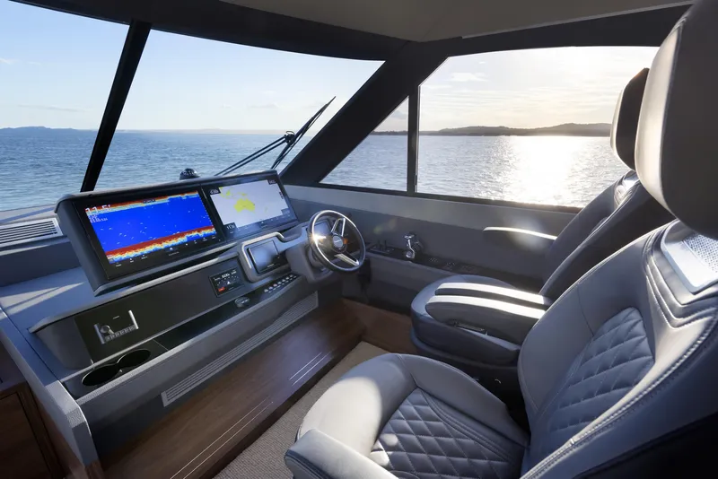 Slide: The Image of Interior of 2026 Maritimo M600 yacht with modern navigation system and luxurious seating. - 12