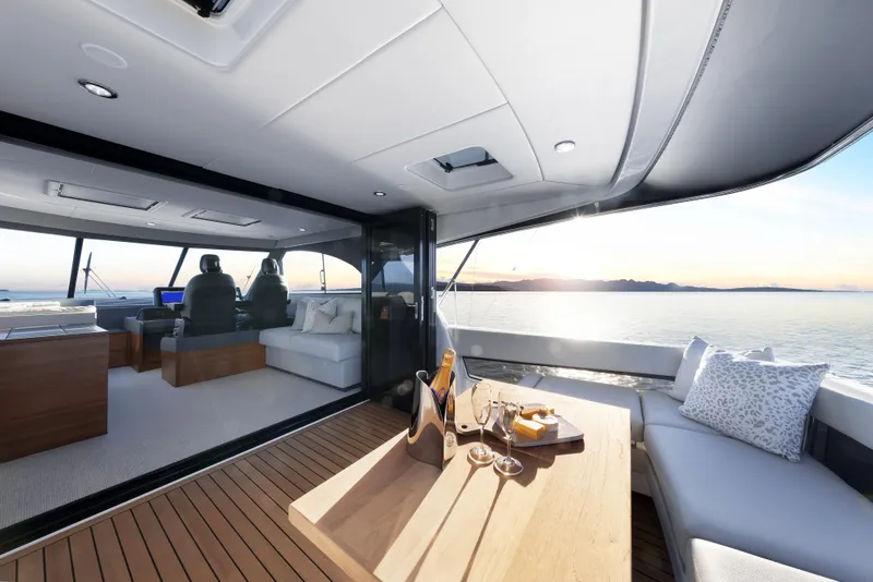Slide: The Image of Luxurious 2026 Maritimo M600 yacht interior with ocean view and elegant dining setup. - 14