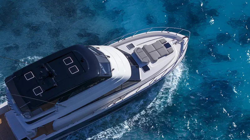 Slide: The Image of 2026 Maritimo M600 yacht cruising on clear blue ocean waters. - 4