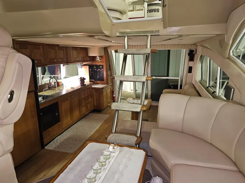 Slide: The Image of Interior of 2001 Cruisers 5000 Sedan yacht with kitchen and seating area. - 25
