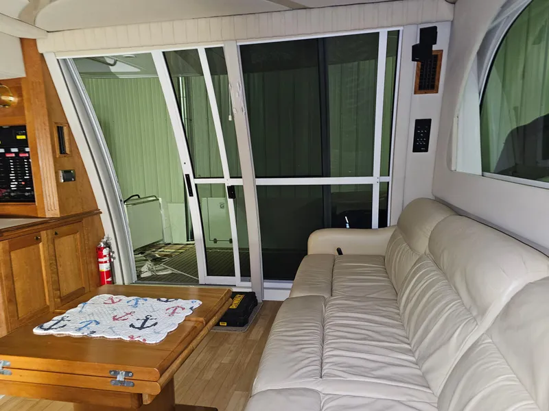 Slide: The Image of Interior of 2001 Cruisers 5000 Sedan with sofa, sliding doors, and wooden table. - 30