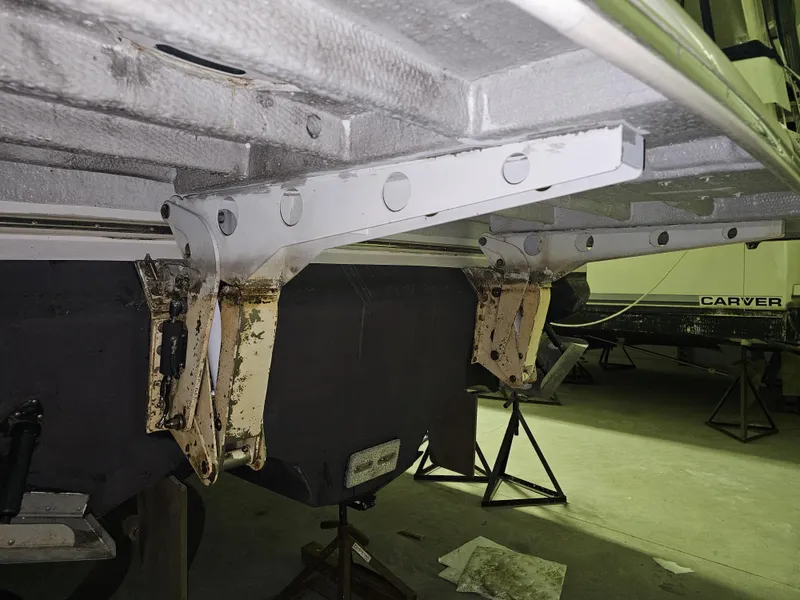 Slide: The Image of 2001 Cruisers 5000 Sedan undercarriage in a workshop setting. - 36