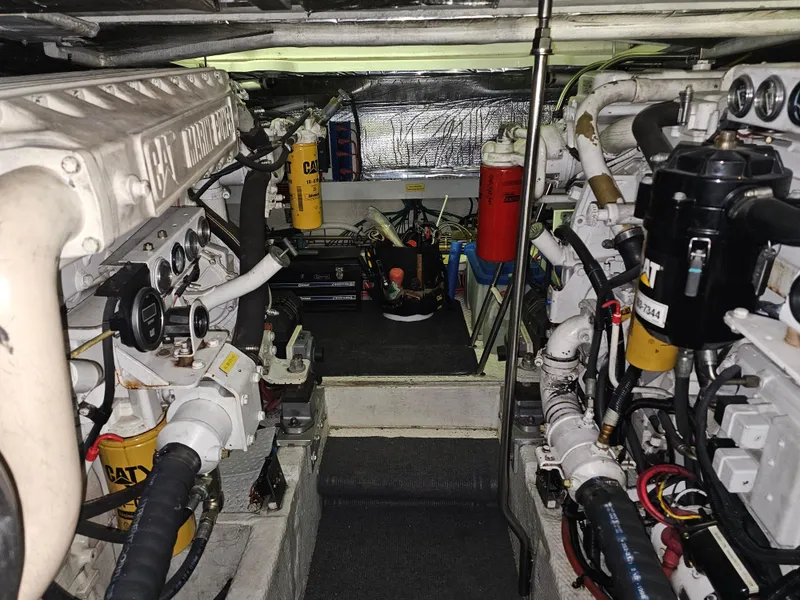 Slide: The Image of Engine room of a 2001 Cruisers 5000 Sedan with CAT machinery and equipment. - 47