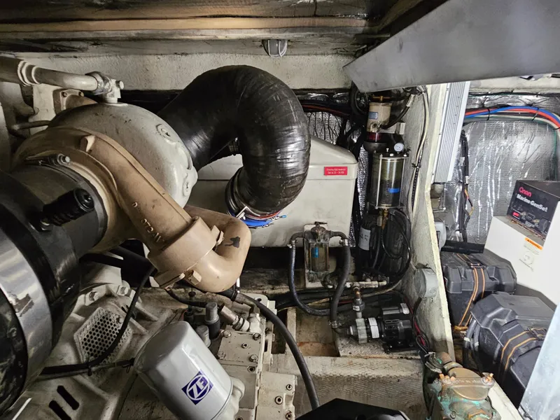 Slide: The Image of Engine room of 2001 Cruisers 5000 Sedan with visible components and wiring. - 48