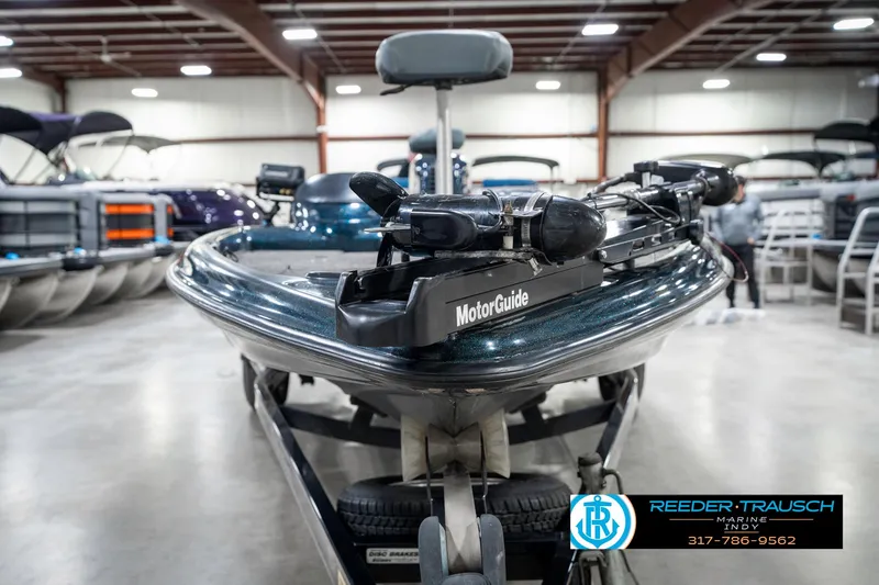 Slide: The Image of 1999 Triton TR-20 boat with MotorGuide, displayed indoors at Reeder Trausch Marine. - 3