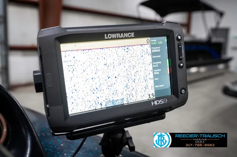 Slide: The Image of Lowrance HDS9 fishfinder on Triton TR-20 boat, 1999 model, in a garage setting. - 36