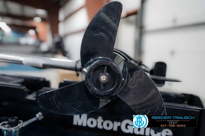 Slide: The Image of Close-up of a MotorGuide propeller on a 1999 Triton TR-20 boat. - 45