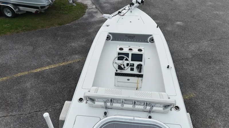 Slide: The Image of Aerial view of a 2023 Vtech 18 boat with a sleek white deck. - 10
