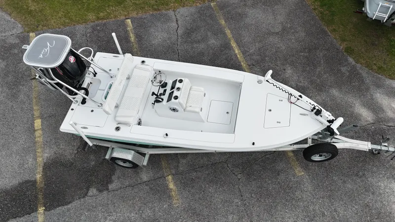 Slide: The Image of Aerial view of a 2023 Vtech 18 boat on a trailer in a parking lot. - 3