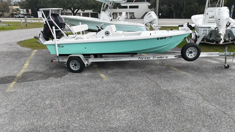 Slide: The Image of Small Vtech 18 boat on trailer, 2023 model, parked in a lot. - 4