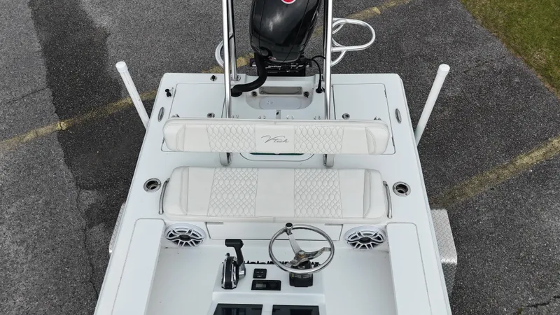 Slide: The Image of Overhead view of a 2023 Vtech 18 boat with seating and steering console. - 7