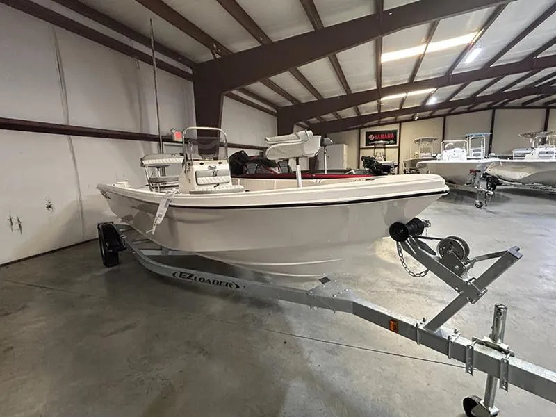 Slide: The Image of 2024 Carolina Skiff 192 JLS boat on trailer in indoor showroom. - 1