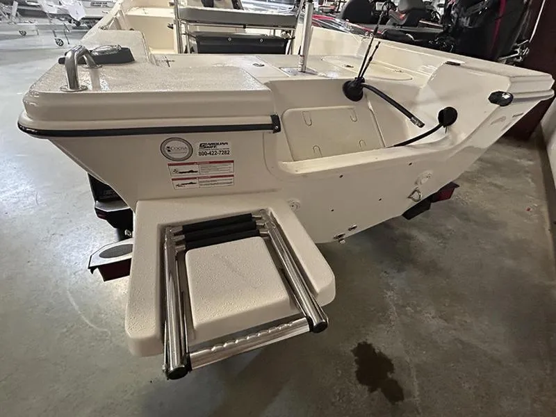 Slide: The Image of 2024 Carolina Skiff 192 JLS boat with swim ladder and clean white deck. - 12