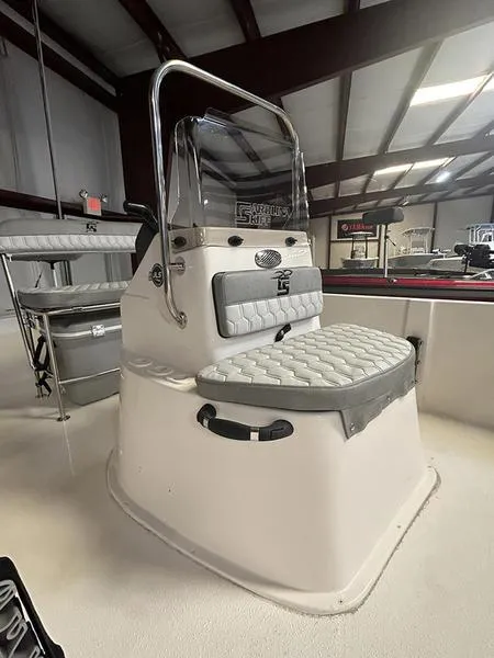 Slide: The Image of 2024 Carolina Skiff 192 JLS boat interior with cushioned seating and console. - 4