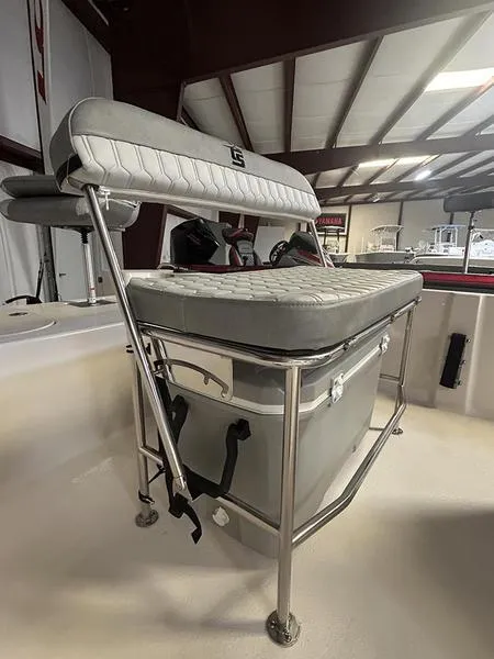 Slide: The Image of 2024 Carolina Skiff 192 JLS boat interior with cushioned seating and storage. - 6