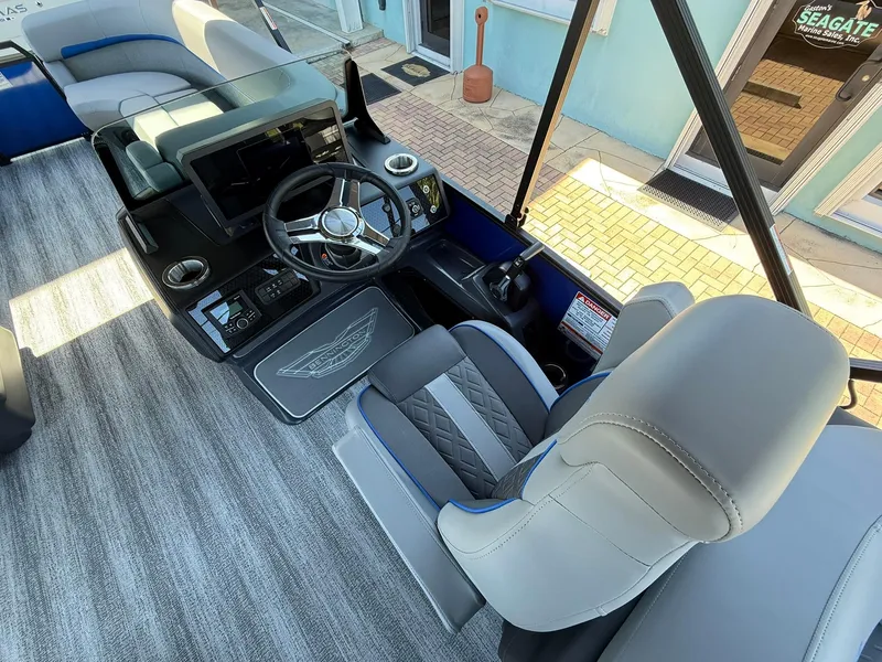 Slide: The Image of 2025 Bennington 24 MFB boat interior with modern steering and seating. - 10