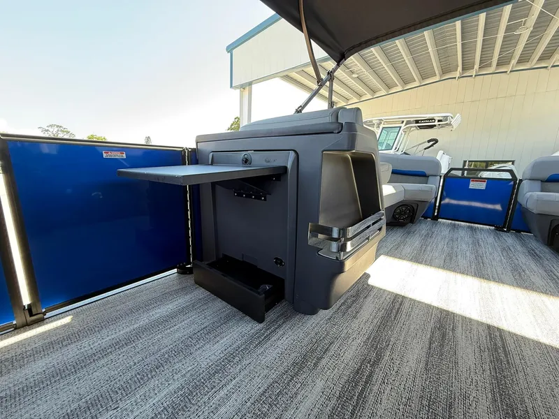 Slide: The Image of 2025 Bennington 24 MFB boat interior with modern seating and storage features. - 18