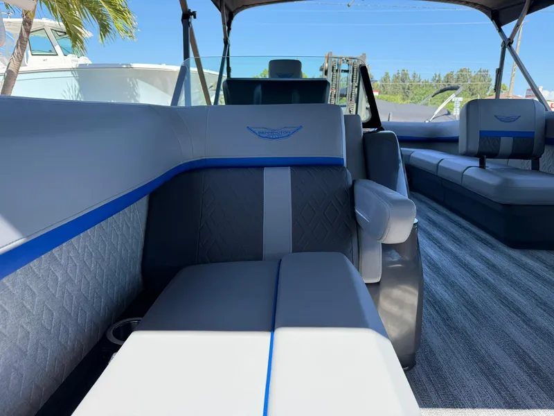 Slide: The Image of 2025 Bennington 24 MFB pontoon boat interior with gray and blue seating. - 22