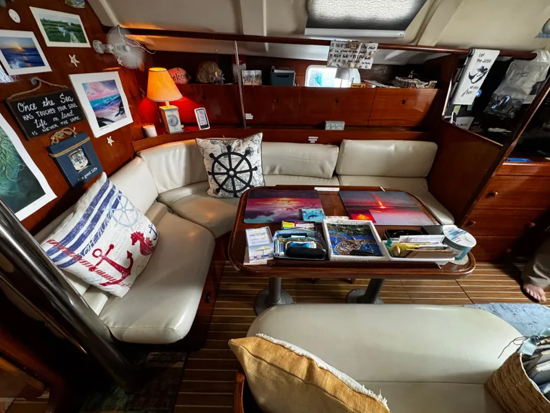 Slide: The Image of Interior bathroom with sink and numerous storage cabinets. Forward of the v berth - 49