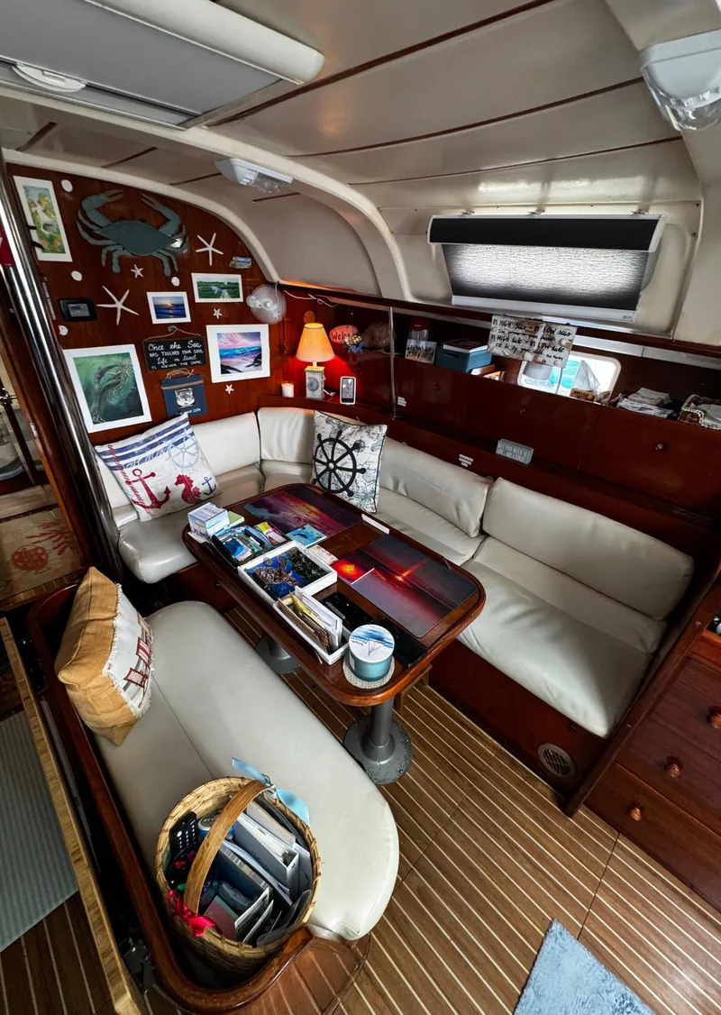 Slide: The Image of Bathroom interior featuring a compact design with sink and marine toilet. Forward of the vberth sleeping area - 50