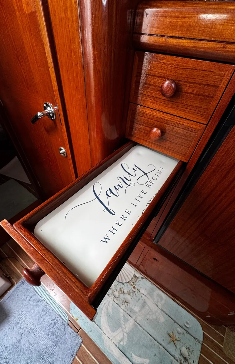 Slide: The Image of 1994 Beneteau 40 yacht interior with cozy cabin, fire extinguisher, and control panel. - 58