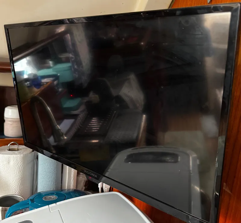 Slide: The Image of Interior cabin of a 1994 Beneteau 40 sailboat with wooden shelves and lighting. - 68