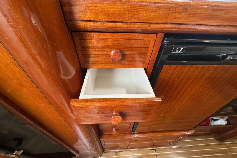 Slide: The Image of Wooden interior of 1994 Beneteau 40 yacht with open drawer and cabinetry. - 83