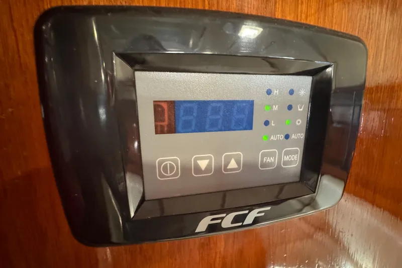 Slide: The Image of Control panel on a 1994 Beneteau 40 yacht, displaying temperature settings. - 89